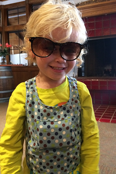 A child wears a LENA word-counting device.