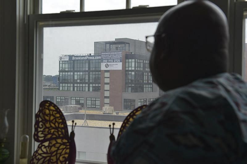 Donta Waters, the president of the tenants’ association, can see Brookland Press from his living room window. (Freddie Allen/AMG/NNPA)