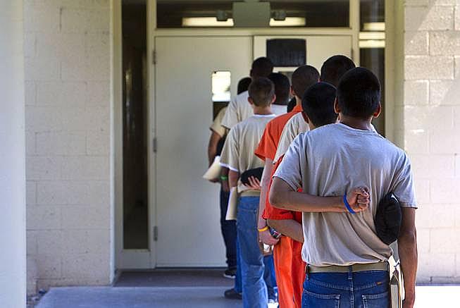 Steve Marcus - Teens head to class at C.O. Bastian High School in the Caliente Youth Center in Caliente, about 150 miles north of Las Vegas, Tuesday, Sept. 8, 2015.