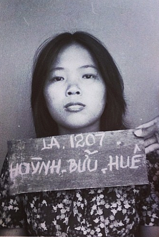 An intake photo of the author's mother, Hue, at a refugee camp in Malaysia.