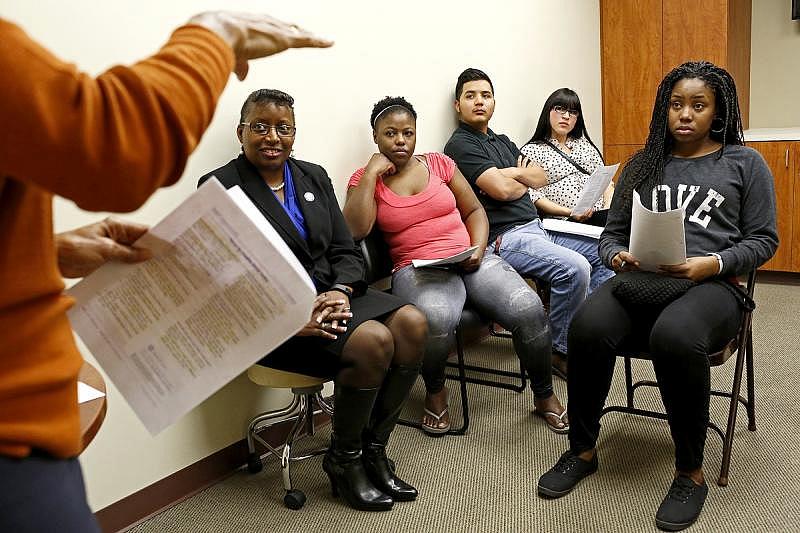 Jean Lawrence lectures on newborn care during a Stork's Nest class in Converse on Dec. 15 for expectant parents including Richard DeLeon Jr. and his girlfriend, Faith Garcia, center, and Jade Brown, right, and guests.