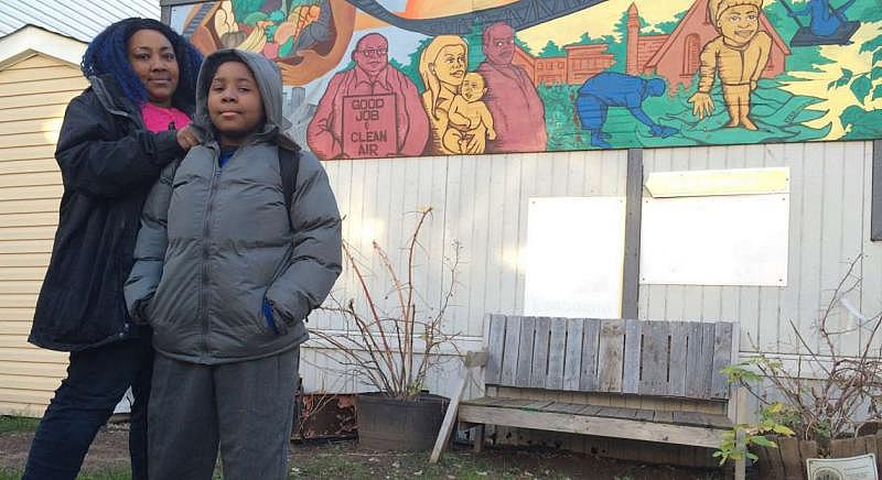 Tamika Bowers and her 10-year-old son, Tíyonn, outside an Ironbound Community Corp. building beside Tíyonn's school. Jamie Smith Hopkins / The Center for Public Integrity 