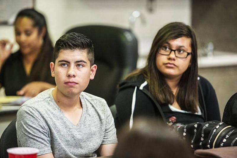 Le Grand High School junior Andy Moreno, 16, listens to Restorative Justice League coordinator Andre Griggs, during a meeting at Le Grand High School in Le Grand, Calif., Tuesday, Aug. 25, 2015. The program trains students to offer support to peers who may be facing challenges at school, home or in the streets.