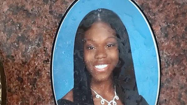 A photo of Noricia Talabert, who was 17 when she was killed by a bullet, is embedded into the grave marker.