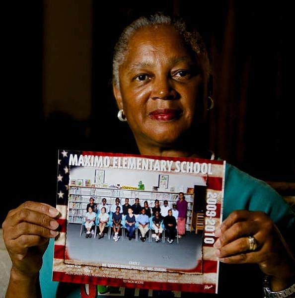Myrna Starling, a teacher who retired five years ago after teaching at Maximo Elementary for nearly three decades. Starling is shown with a class photo from 2010, her last year at Maximo.