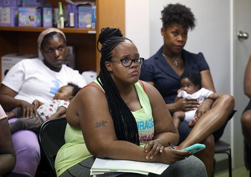 Coretta Daniel, center, delivered her second baby, Zaria, with the help of BBC doula and founder, Christin Farmer. She says the group's services are "so needed" in her community, and can't wait to see them expand. (Thomas Ondrey, The Plain Dealer)