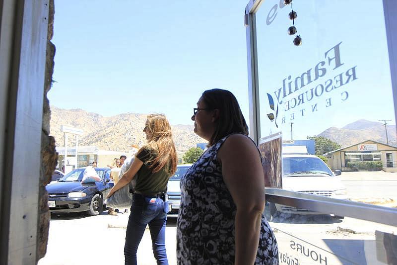 Christy Luton gifts some clothes to a few of her clients at Women's Center High Desert in Lake Isabella. Harold Pierce/The Californian