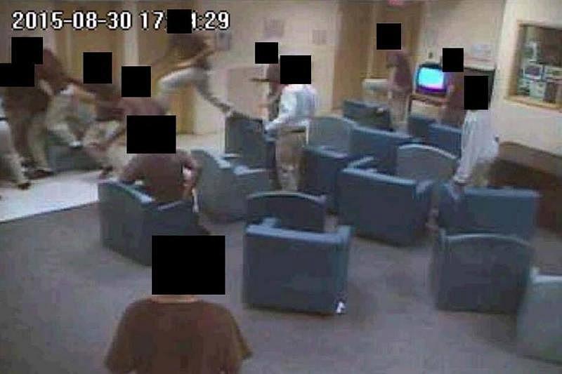 Detainees at the Miami juvenile lockup jump over chairs to get at Elord Revolte, who is in the upper left-hand portion of this video surveillance image, already engulfed. Miami-Dade State Attorney