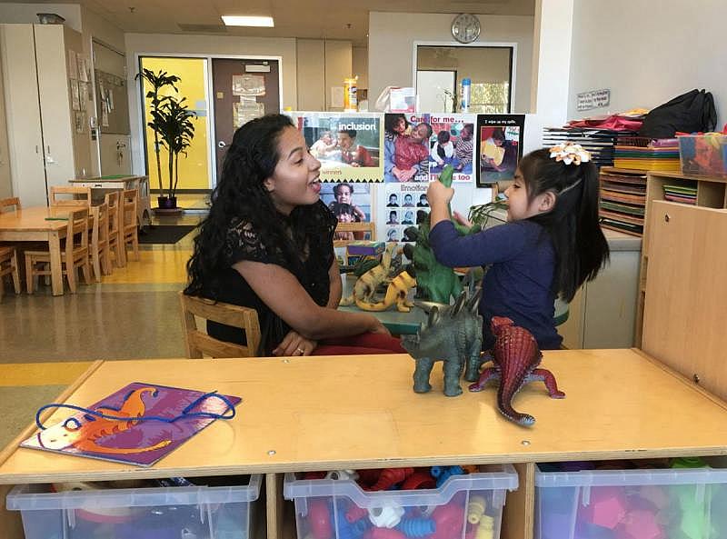 The Magnolia Place collaborative in Los Angeles identified four areas needed to create a safe environment in which children can be free of abuse: educational success, good health, economic stability, and safe and nurturing parenting. Above, Joshi Zamudio and daughter Aylin Ramirez, 3, play during a family enrichment program at Magnolia Place.