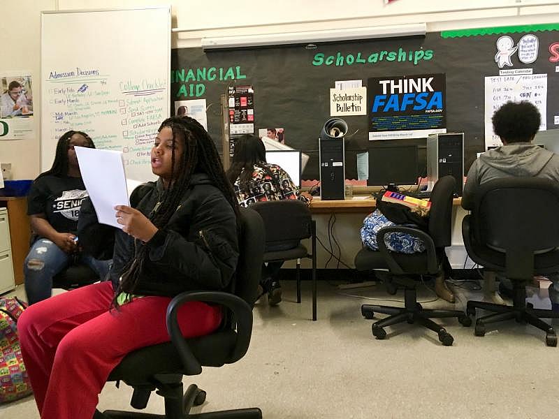 Destiny Shabazz, 17, works on scholarship applications at McClymonds High School’s College & Career Center. (Lee Romney/KQED)