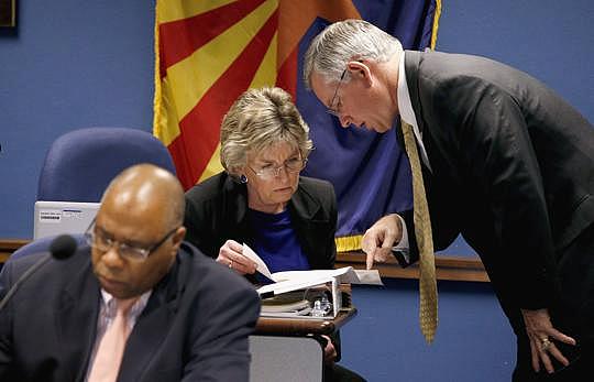 The Legislature cut critical services to families during the recession. The result was a deluge of children flooding into out-of-home care. Above, Rep. Kate Brophy McGee, R-Phoenix, discussed the crisis with Maricopa County Attorney Bill Montgomery. Ross D. Franklin / Associated Press 2013