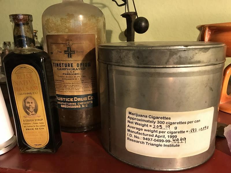 Lonnie Painter collects antique opioid- and cannabis-based tinctures. The large tin is from an experimental federal program that provides marijuana pre-rolls to selected patients around the country. Lonnie Painter collects antique opioid- and cannabis-based tinctures. The large tin is from an experimental federal program that provides marijuana pre-rolls to selected patients around the country.