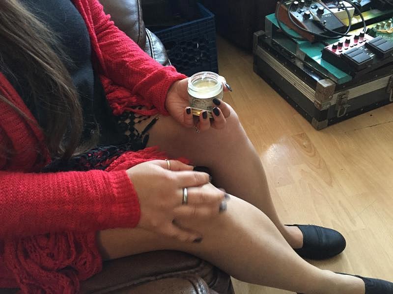 Carmen Morales rubs cream on her knees to ease the pain. Carmen Morales rubs cream on her knees to ease the pain.
