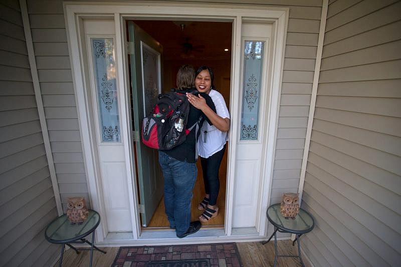 Todd Cirillo of Children’s Bureau is greeted by Marigny Savala.