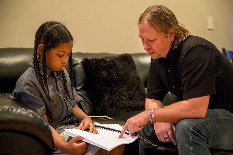 Malachi Hill visits with therapist Todd Cirillo from Children’s Bureau.