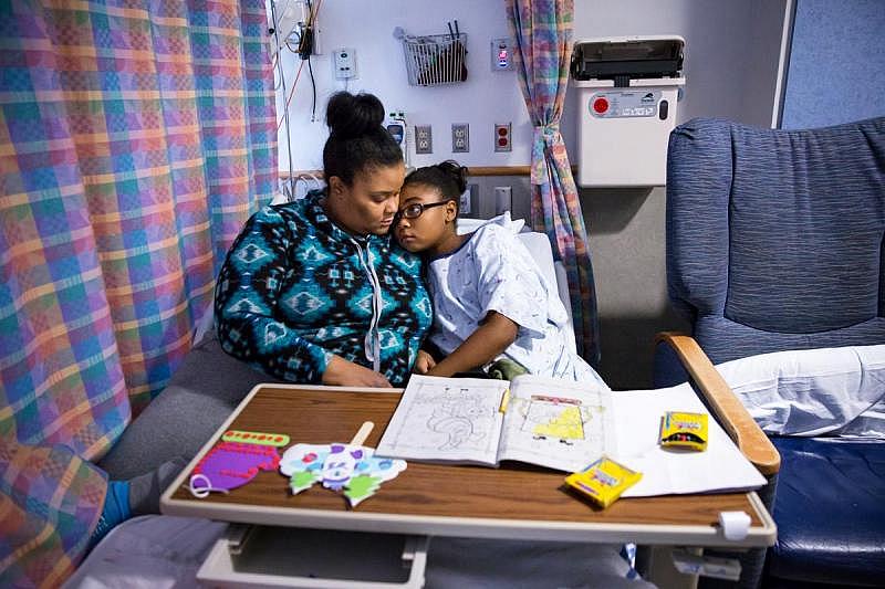Denise Garner and her 9-year-old daughter, Ashley, at Children’s Hospital of Philadelphia. Ashley suffered a severe asthma flare-up that required a trip to the emergency room and a hospital stay in January.