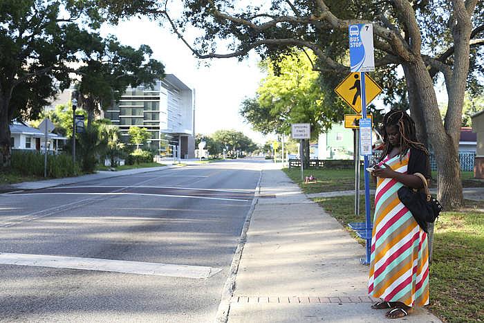 Lalandria waits for the bus to take her to a job interview in June.