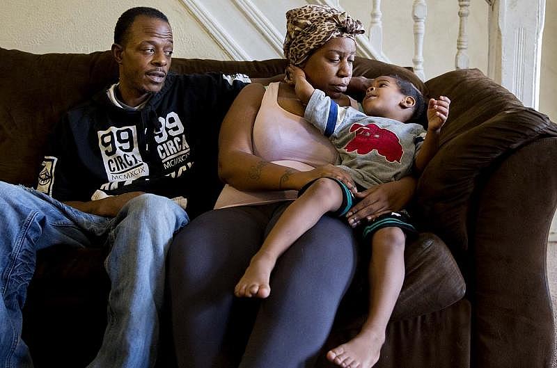  Gregory Jackson and longtime partner Sophia Pope with their son Vaughn Jackson, 3, at their home in Germantown. Sophia and Gregory are happy that Vaughn is once again more active and alert, but they have concerns for his future development.