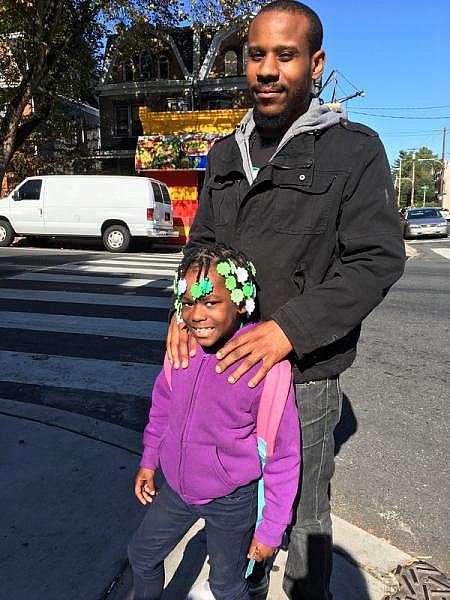 Parent Rakeem Ingram with his daughter, Jessiah, 7, a first grader at John B. Kelly Elementary in Germantown. He says parents shouldn’t be kept in the dark about serious health hazards at their child’s school. Wendy Ruderman / Staff