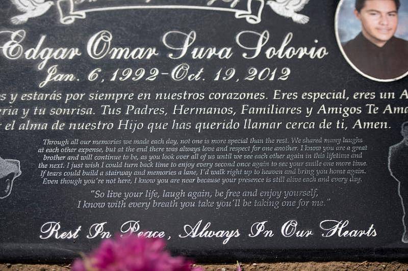 Edgar Omar Sura’s gravestone says in part, “I just wish I could turn back time to enjoy every second once again to see your smile one more time…” His heart-broken parents regularly visit his grave in Santa Ana. (Photo by Mindy Schauer, Orange County Register/SCNG)