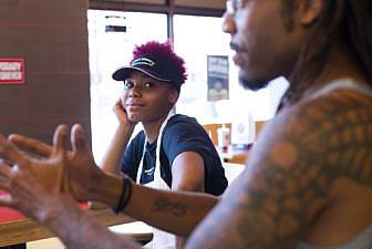 Demontrea Broach, 17, listens while her manager, Brian Palmer, tells a story on Monday, June 18. Broach started working at Jimmy Johns last Tuesday but said she already loves her job.