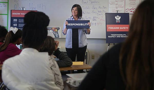 More Health instructor Kate Myers gives a firearm safety class to sixth-graders at Azalea Middle School in St. Petersburg on Feb. 17. The class is presented in pubic schools around the region and highlights lessons in "Responsibility, Respect, and Reason."