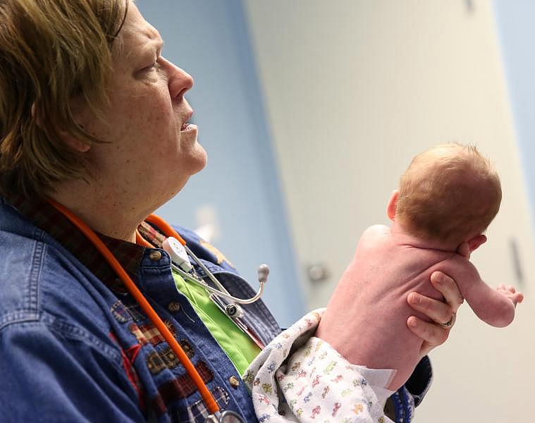 Dr. Norma Kreilein gives Matthew Riggle, who was born premature, a checkup in November in Washington, Indiana. (Photo: Damian Rico/The Times of Northwest Indiana)
