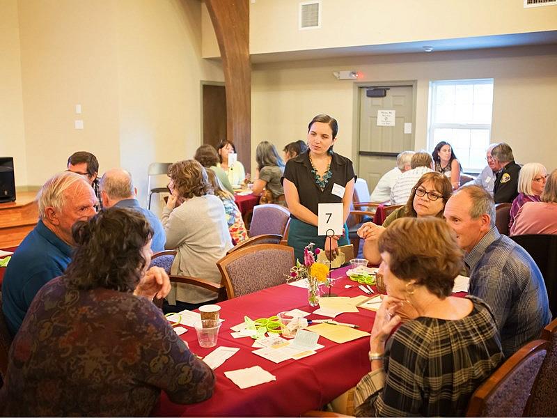 CapRadio reporter Sammy Caiola listens in as attendees discuss how to prevent suicide in Amador County. Vanessa S. Nelson / Capital Public Radio