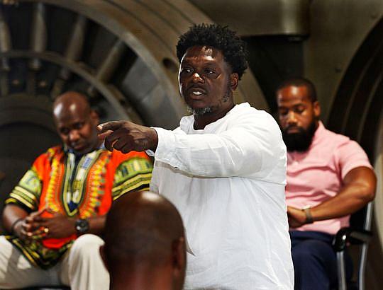 Kwabena Nixon moderates "Real Talk" sessions at Gee's Clippers in Milwaukee. (Photo: Angela Peterson/Milwaukee Journal Sentinel)