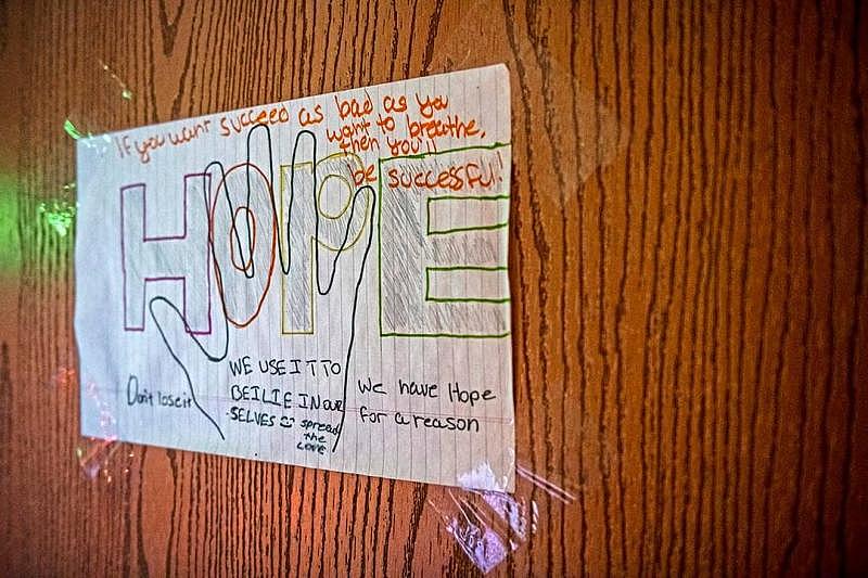 A drawing with the word “Hope” along with inspirational words hangs on the door to Jared Todd's room as he plays the video game “Warframe” at his home in Hawkins Village. A drawing with the word “Hope” along with inspirational words hangs on the door to Jared Todd's room as he plays the video game “Warframe” at his home in Hawkins Village.
