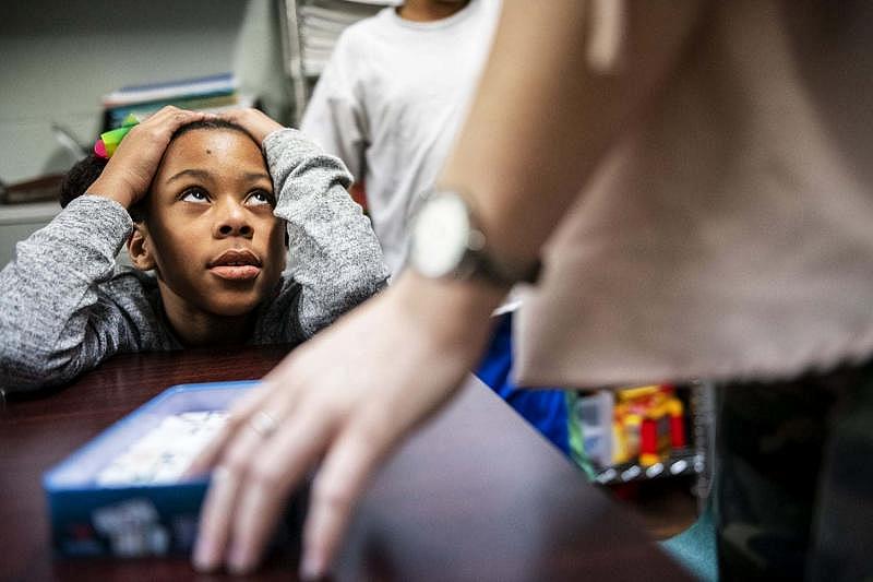 Laneyia Keating, left, gets words of encouragement from Leighanna Thompson of Louisville during Volunteers of America’s Study Buddy program, Thursday, Jan. 24, 2019, at Transitional Housing Program & Emergency Family Shelter in Louisville, Ky.