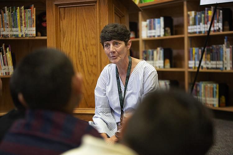 Tami Keeling, president of the Victoria school board, talks with third-grade students at Torres Elementary about what they experienced during Hurricane Harvey. 