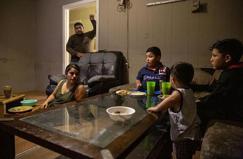 Sanchez Salas asks the family if they need more tortillas during dinner. Barrientes sits on the floor and uses steps as a table while Jonathan, Fernando and Nathan eat off the coffee table. Barrientes said typically she eats on the coffee table and Nathan sits on the steps.