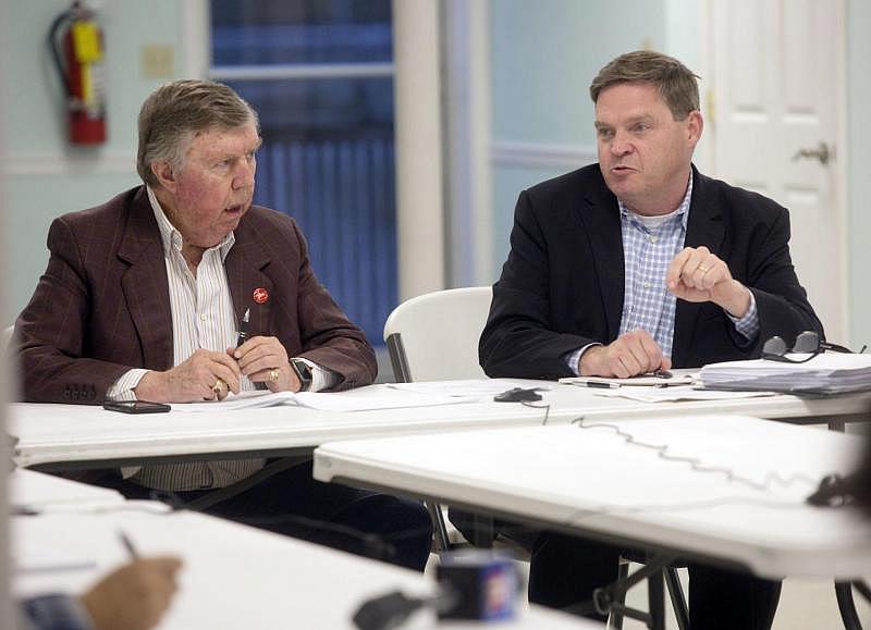 Lee County Hospital Authority Vice Chairman Ronnie Montgomery (left) and authority attorney Jeff Mitchell during a meeting in November talk with Americore CEO Grant White by conference call. 