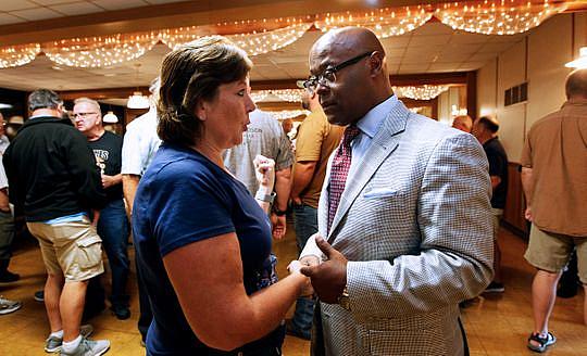 Sharon Bea (left) talks with Sheriff-elect Earnell Lucas before the start of the Milwaukee County Sheriff's Deputy retirees luncheon in Hales Corner (Photo: Angela Peterson/Milwaukee Journal Sentinel)