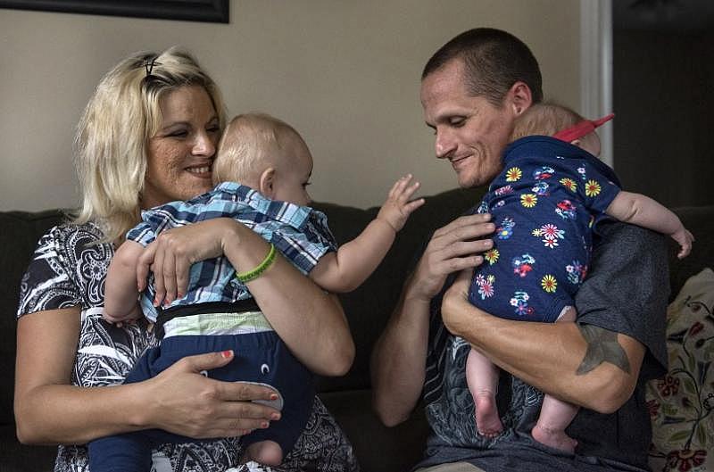 Cheyenne Easter and Jeremy Jones with Sebastian, 13 months and Charlotte, 3 months, spent years living on the streets addicted to drugs and alcohol. They journeyed into the legal system and eventually into sobriety. They are hoping to be awarded full custody of their children early next year. (Photo by Mindy Schauer, Orange County Register/SCNG)