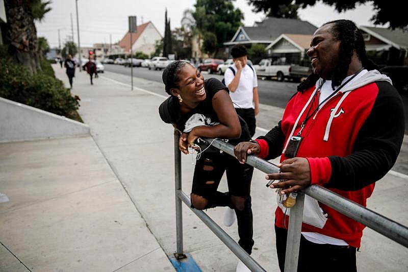 Jaleyah Collier, a senior at Hawkins High School, talks to Andre Vickers of Chapter Two, a local gang prevention program. (Marcus Yam / Los Angeles Times)