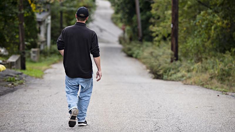 Travis Litts walks down East Snyder Avenue in Lansford. Rick Kintzel / The Morning Call