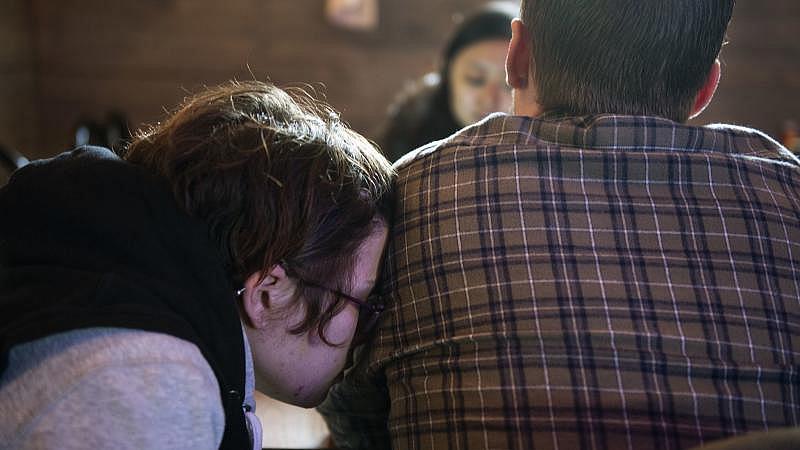 Alicia Kachmar places her head on the shoulder of her fiancée Travis Litts while eating lunch at the Coal Miners Bar & Grill in Lansford. Rick Kintzel / The Morning Call
