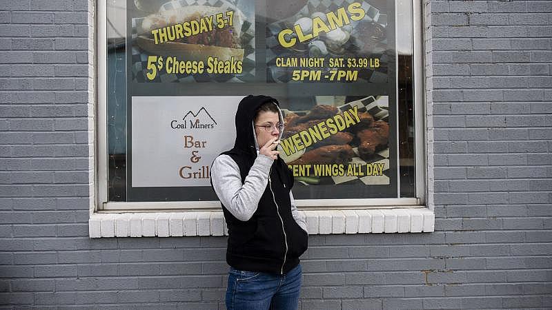 Alicia Kachmar of Lansford takes a puff from her cigarette outside of Coal Miners Bar & Grill in Lansford. Rick Kintzel / The Morning Call