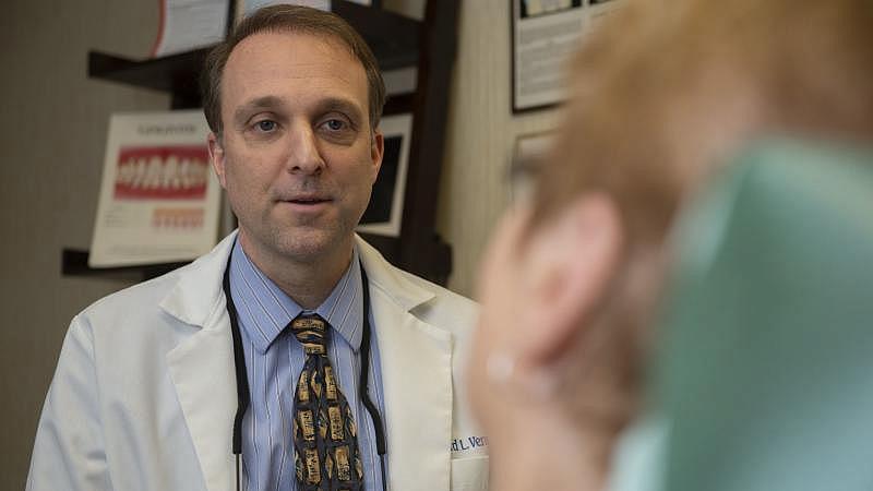 Dr. Richard Vermillion talks to a patient at his office in Summit Hill. Rick Kintzel / The Morning Call