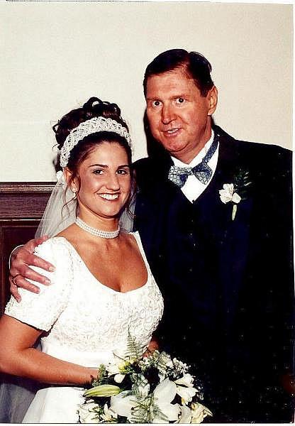  Cheryl Youngbloood's husband, Michael Youngblood, poses with their daughter, Amy, at her wedding in May 1999. He died before he could walk his baby girl, Stacie, down the aisle.