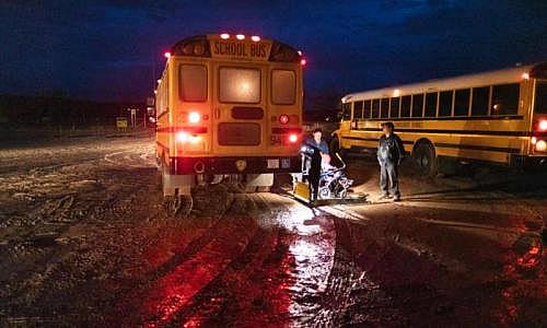 Parents are forced to drop their children at the Sanostee chapter house because the buses are unable to navigate the muddy roads. Photograph: Don J Usner/Searchlight New Mexico