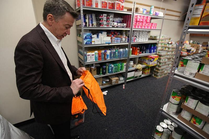 In March, Indiana University professor Jack Turman shows a bag students fill with free food and hygiene products at Grandma's Cupboard, a pantry he helped start at Sarah Scott Middle School in Terre Haute. The city is the county seat of Vigo County, which had the highest rate of child neglect investigations in the state in 2017. (Giles Bruce, The Times)
