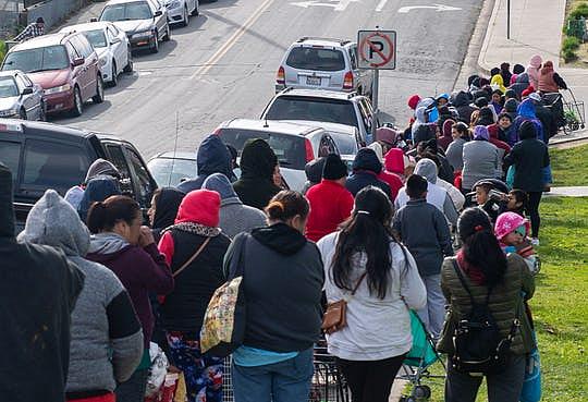 A line of Salinas residents await their chance to get food benefits from members of The Celebration Church. The members offer clothes, eggs, canned food and restroom supplies on Jan. 18, 2020.  (Photo: David Rodriguez/The Salinas Californian)