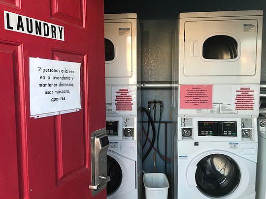 A sign on the laundry room door cautions motel H-2A guests that only two can occupy the room at a time. April 13, 2020. (Photo: Kate Cimini / The Salinas Californian) A sign on the laundry room door cautions motel H-2A guests that only two can occupy the room at a time. April 13, 2020. (Photo: Kate Cimini / The Salinas Californian)