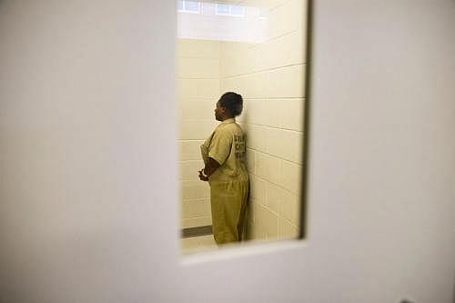 Ashley Peterson makes her way back to her cell inside the Douglas County Jail in Douglasville, Georgia. (MYKAL MCELDOWNEY/INDYSTAR)