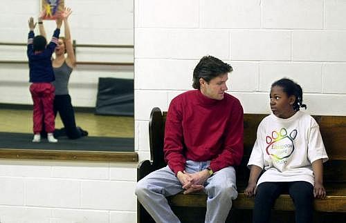 Ashley and her adoptive father Craig Peterson chat during a break in a dance class. (INDYSTAR FILE PHOTO) Ashley and her adoptive father Craig Peterson chat during a break in a dance class. (INDYSTAR FILE PHOTO)