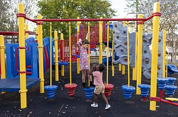 Ruthie, 7, left, and Justice, 6, play on the equipment at Soraparu Playspot 