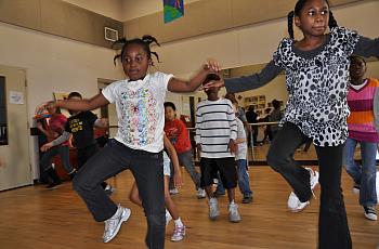 Kids practicing zumba in Gymnasium